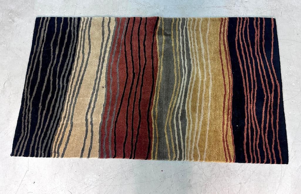 Contemporary Hand-Tufted Wool Area Rug: Contemporary hand-tufted wool area rug featuring an abstract striped composition in black, taupe, olive, gold, rust, and cream tones. The design employs irregular linear bands creating a layered, orga