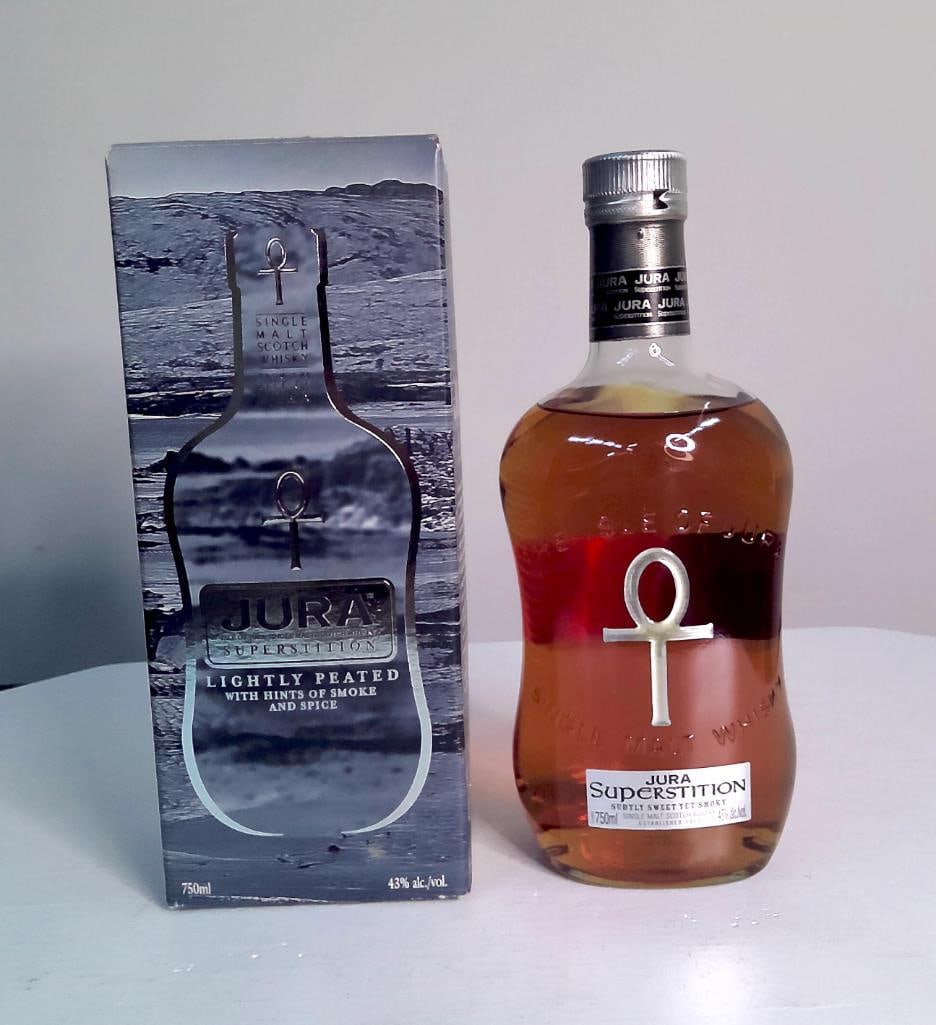 Jura Superstition Single Malt Scotch Whisky, 750ml, with Box: Jura Superstition Single Malt Scotch Whisky, 750ml, with Box Isle of Jura "Superstition" single malt Scotch whisky, lightly peated with hints of smoke and spice, 750ml, 43% ABV, in original pr