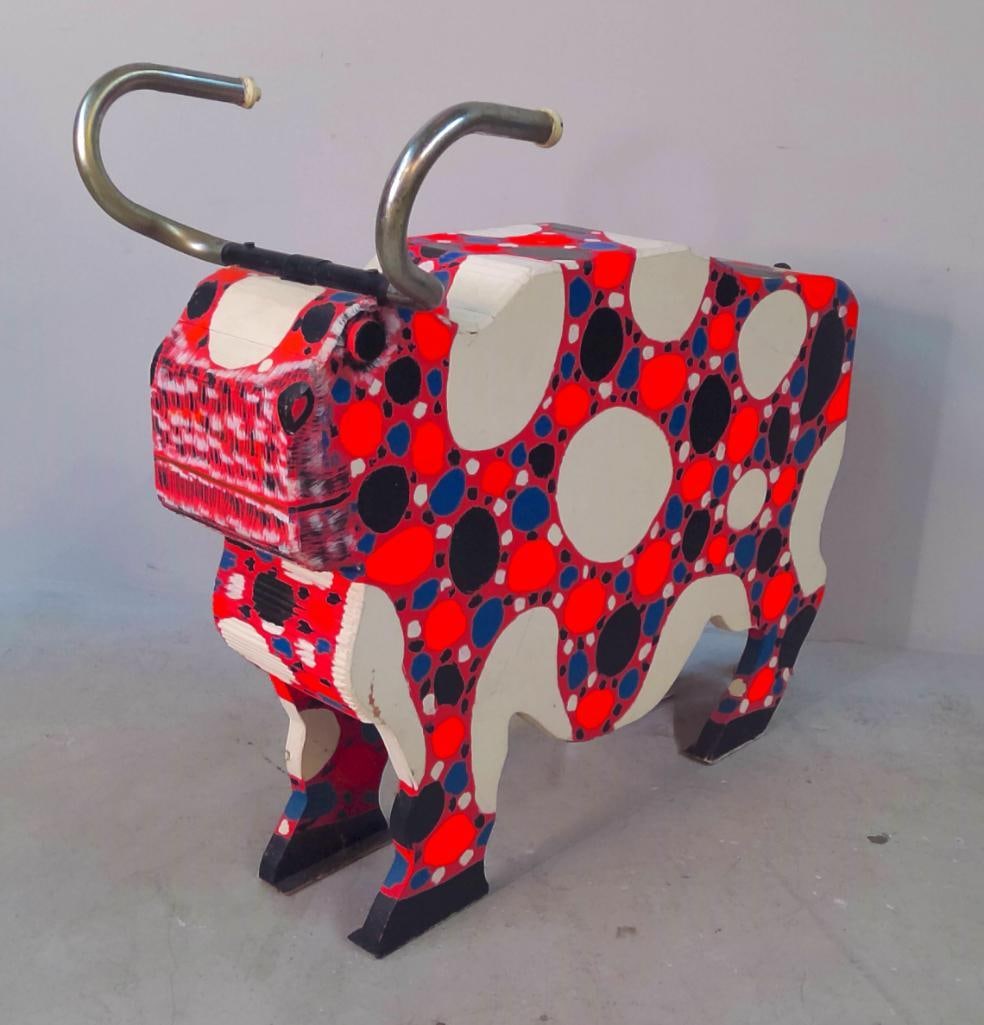 Marvin Finn (American/Kentucky, 1913–2007): Bull, 1983, Large Southern folk-art sculpture depicting a bull, constructed from cut and laminated wood and painted throughout in vivid red, blue, black, and cream spotted patterns. The animal is fitt
