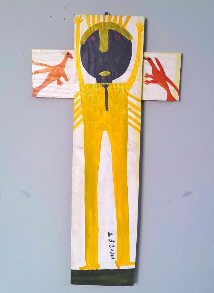 Mose Tolliver (American/Alabama, c. 1920–2006): Yellow Figure With Birds, House paint on found wood assemblage depicting a long-limbed yellow figure with raised arms, a dark mask-like face, and two orange-red birds. Constructed from joined boards i