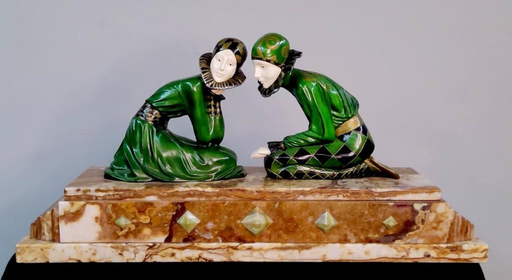 Attributed to Demétre Chiparus (Romanian/French, 1886–1947): Tender Promises, a Chryselephantine Group of Harlequins, A substantial Art Deco chryselephantine figural group depicting two kneeling harlequins engaged in intimate conversation, each modeled with car