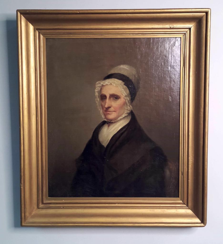 19th-Century American School Portrait of an Elderly Woman: 19th-Century American School Portrait of an Elderly Woman This unsigned portrait depicts an unidentified elderly woman wearing a white lace bonnet, dark dress and white fichu against a muted brown bac