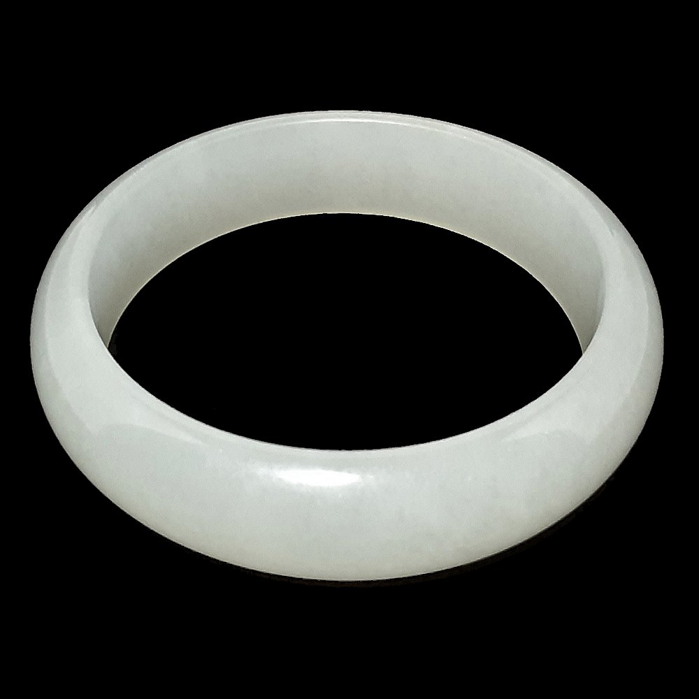 A VERY FINE CHINESE WHITE JADEITE MUTTON FAT BANGLE: A VERY FINE CHINESE WHITE JADEITE MUTTON FAT BANGLE. Inner diameter: 60. outer diameter 78 mm; 61 g.Provenance: private Florida collection.