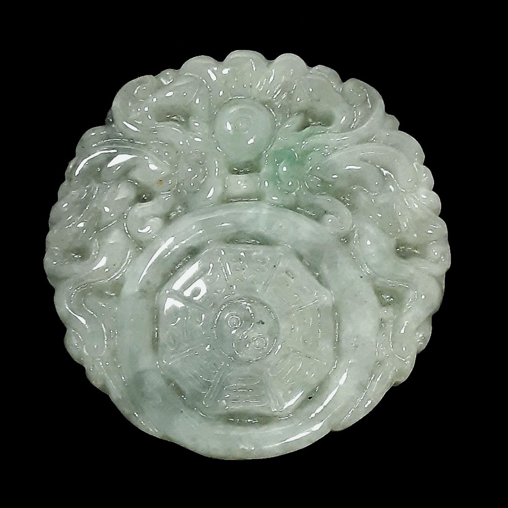 FINE CARVED LIGHT GREEN JADEITE PENDANT: FINE CARVED LIGHT GREEN JADEITE PENDANTD: 1.8”, 47 mm; 32.6 g.Provenance : private Florida collection.