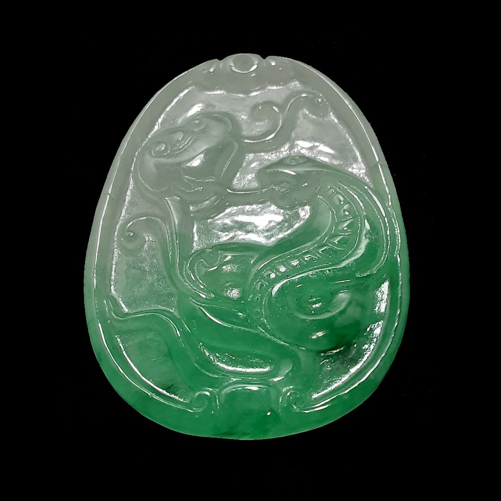 CHINESE GREEN, WHITE JADEITE PENDANT, SERPENT 巳: The fine pendant featuring a snake and lotus.L: 1.6”, 4.2 cm; W: 1.2”, 3 cm; 13.6 g.Provenance: Private Florida collection.