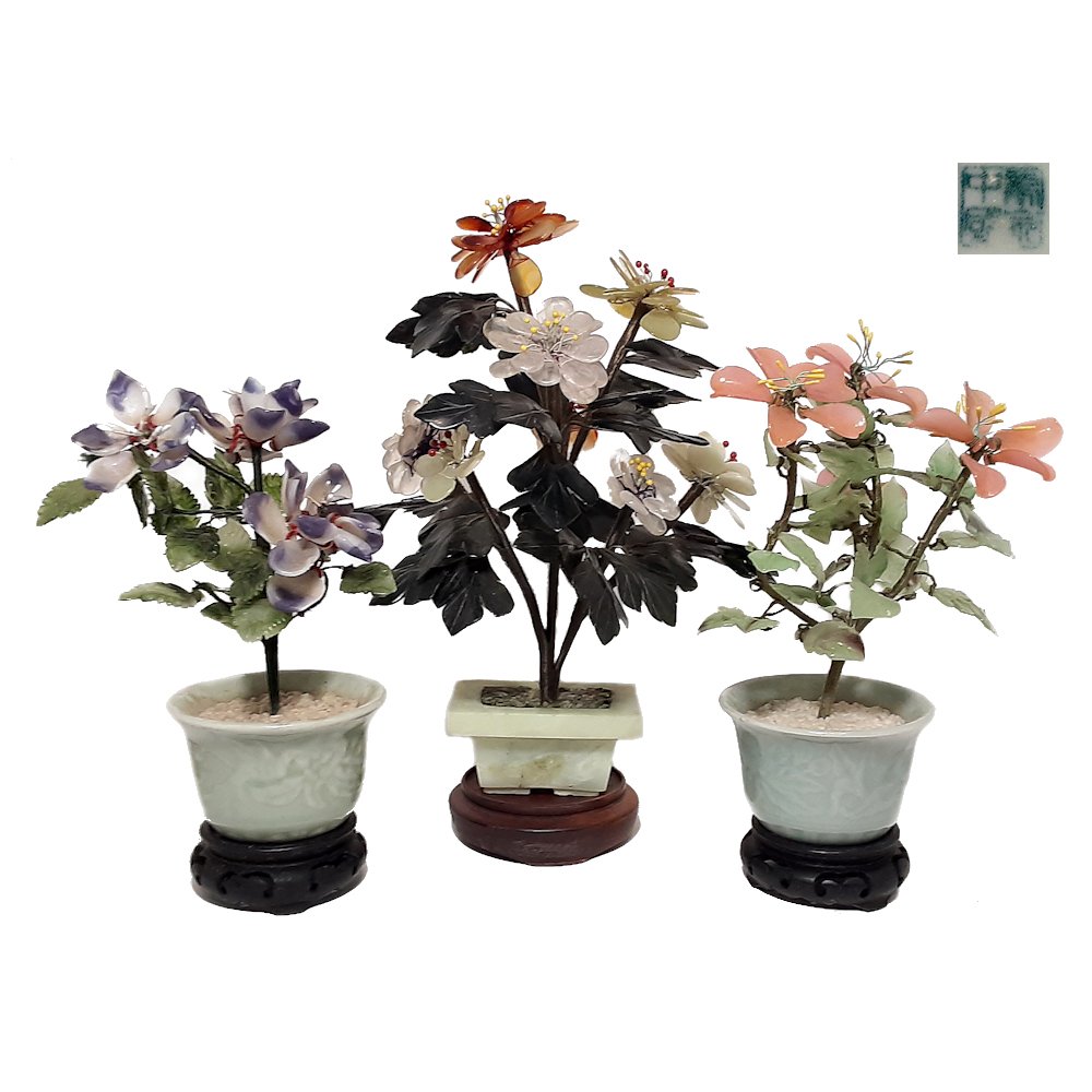 CHINESE JADE TREE & 2 PEKING GLASS TREES CELADON POTS: The lovely lot of trees includes one jade and carnelian tree and two peking glass trees in carved celadon pots. The jade tree seems in very fine condition. It is 10 inches, 25 cm tall. The two peking 