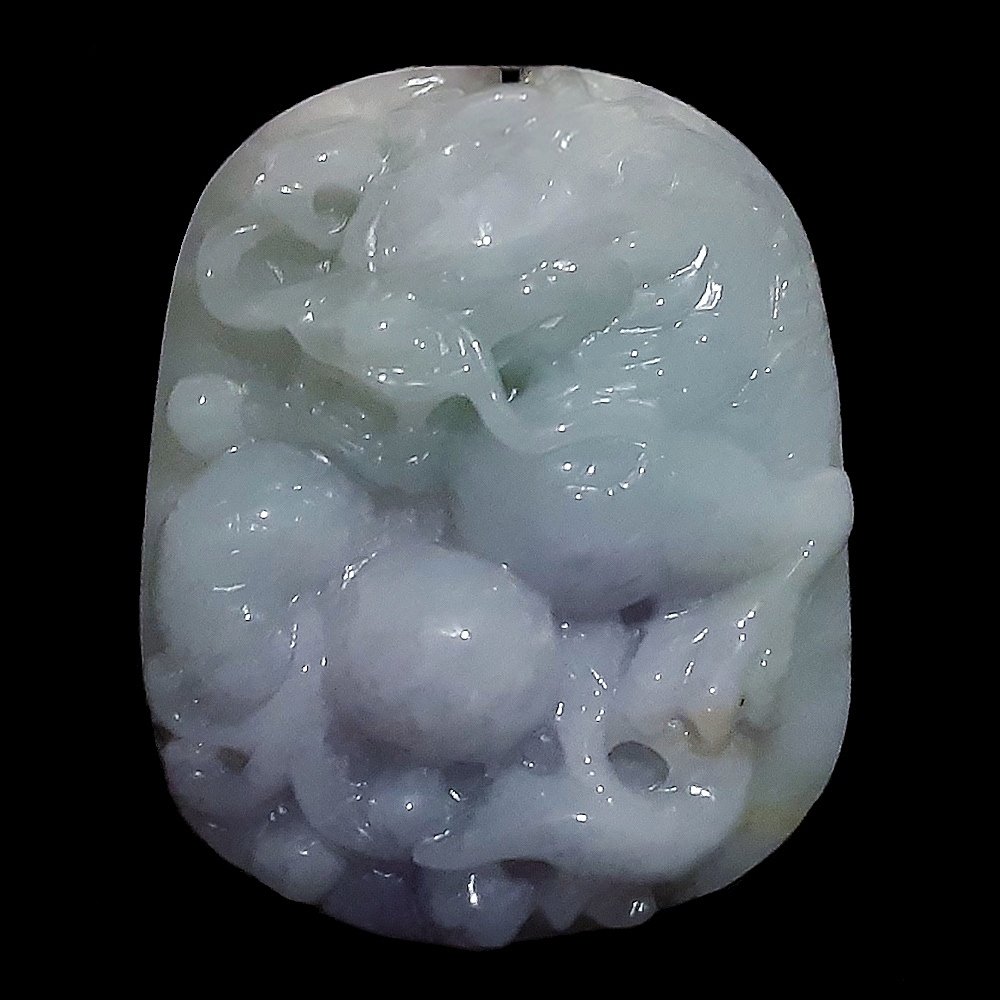 OUTSTANDING JADEITE PENDANT DRAGON LAVENDER GREEN: The superb pendant carved in high relief with smooth and masterful lines. It depicts a fierce dragon. The jadeite is in natural shades of lavender and light green. Weight 45 grams. Length 5 cm.Provena