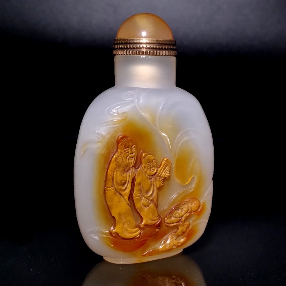 A FINELY CARVED AGATE SNUFF BOTTLE IMMORTALS (1 of 9)