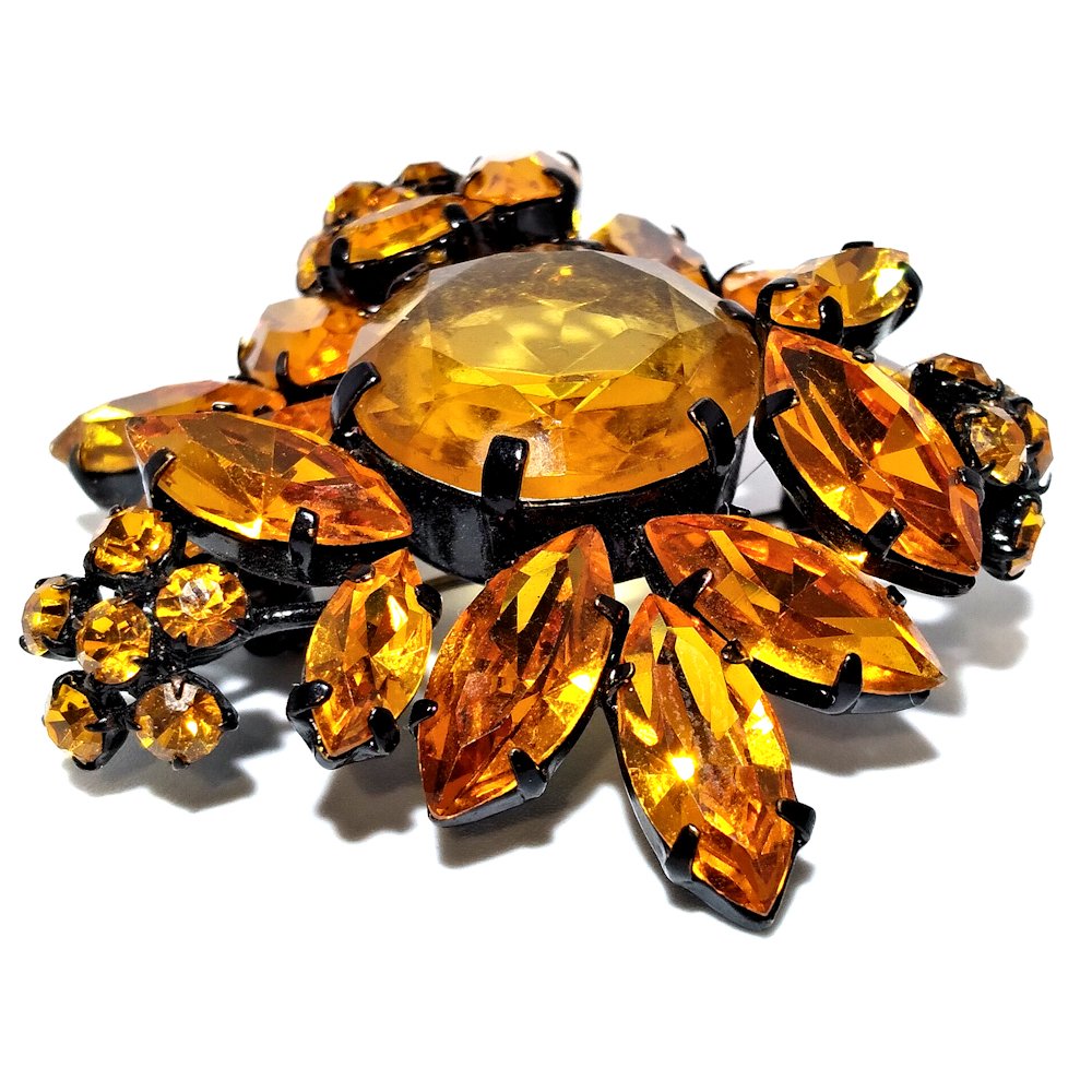 STUNNING SCHREINER BROOCH TOPAZ COLOR: THE INTRICATELY CONSTRUCTED SCHREINER BROOCH IS UNMARKED. IT IS TWO INCHES IN DIAMETER.