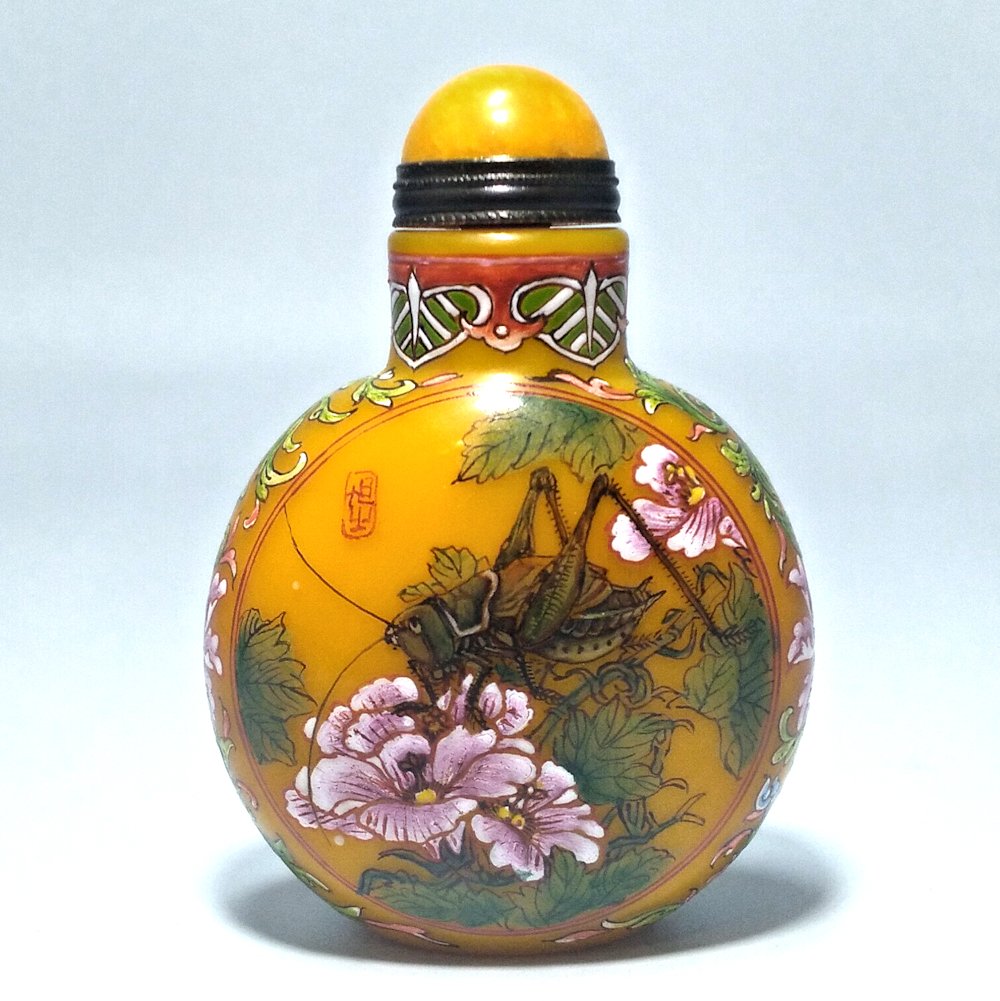 SUPERB CHINESE ENAMEL GLASS SNUFF BOTTLE CRICKETS QING: THE OUTSTANDING BOTTLE IS MASTERFULLY ENAMELED ON YELLOW BACKGROUND. IT FEATURES TWO SCENES WITH CRICKETS, WATERMELON, LADYBUG, FLOWERS AND MORE. THE BOTTLE BEARS A QIANLONG DATE MARK.ARTIST SIGNED ON
