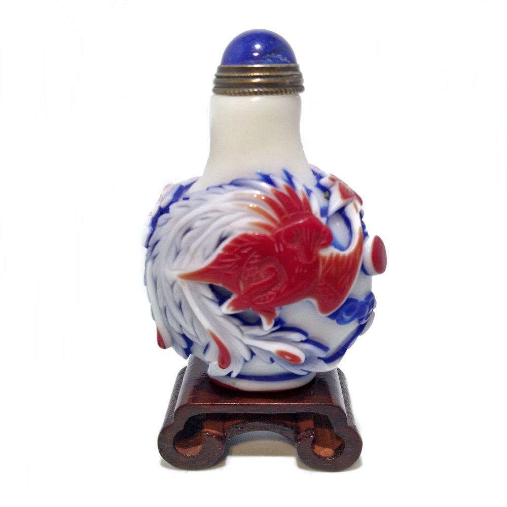 FINE OVERLAY GLASS SNUFF BOTTLE 4 LAYERS, DRAGON: THE OUTSTANDING BOTTLE IS CARVED IN 4 LAYERS OF GLASS: WHITE, BLUE, WHITE AGAIN AND RED. THE CARVING IS EXCELLENT, DEPICTING A FIERCE DRAGON CHASING A PEARL. THE OTHERSIDE FEATURES A PHOENIX. IT IS 2.