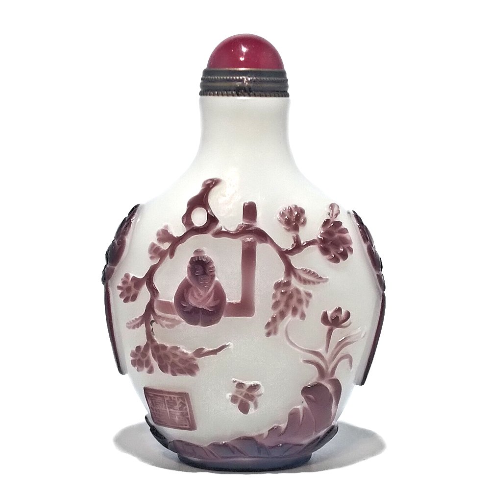 A SIGNED CHINESE OVERLAY GLASS SNUFF BOTTLE 18-19 C RARE COLORS: THE FINE BOTTLE IS COMPOSED OF A RARE COMBINATION OF AMETHYST PURPLE ( MORE PURPLE THAN PICTURED) OVER A WHITE GROUND. THE CARVINGS ARE DONE WITH MINUTE DETAIL, DEPICTING IMMORTALS, A CHILDATTENDANT, 