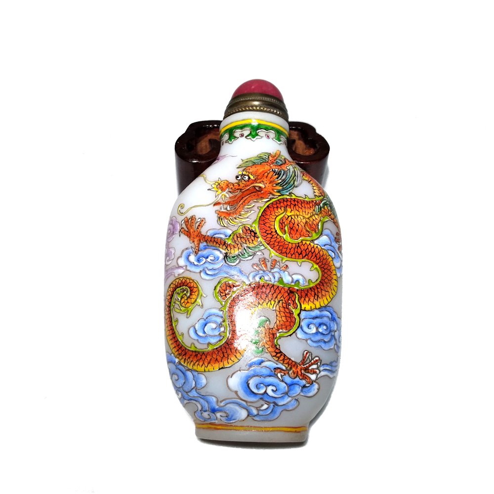 STUNNING PEKING GLASS ENAMEL SNUFF BOTTLE DRAGON AND PHOENIX: THIS SPECTACULAR SNUFF BOOTLE DEPICT AN AMAZING IMPERIAL DRAGON 5 CLAWS AND ON THE OTHER SIDE A FABULOUS PHOENIX. THE WORKMANSHIP IS FANTASTIC! IS WEARING A QIANLONG MARK ON THE BOTTOM. SIZE ALMOST 3"