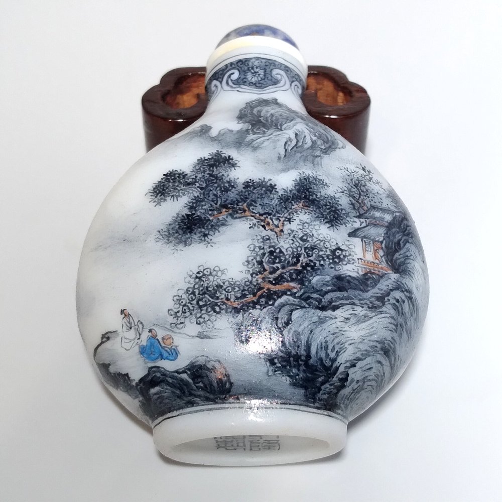 CHINESE ENAMEL GLASS SNUFF BOTTLE GRISAIILE LANDSCAPE: THE EXQUISITELY ENAMELED BOTTLE OVER GLASS, FEATURES VERY DETAILED MINIATURE LANDSCAPES. BEARING A QIANLONG DATE MARK. THE BOTTLE IS 2.9 INCHES TALL. PROVENANCE: PRIVATE FLORIDA COLLECTION.