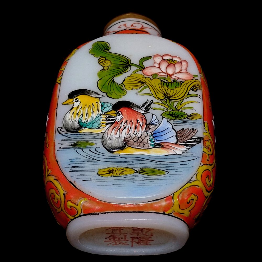 EXCELLENT ENAMEL GLASS SNUFF BOTTLE MANDARIN DUCKS: THE BOTTLE SO FINELY ENAMELED FEATURING MANDARIN DUCKS SWIMMING, WITH MUCH DETAIL ALL AROUND. THE SIDES ARE DECORATED IN STUNNING PATTERNS AND COLORS. THIS GREAT BOTTLE BEARS A QIANLONG MARK. IT IS 2.