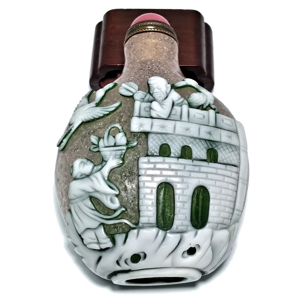 FINE PEKING GLASS SNUFF BOTTLE LUOHANS SCENIC: THE FINE BOTTLE FEATURING LUOHANS IN BEAUTIFULLY DETAILED SETTINGS, INCLUDING A DEER AND A BOAT, GEESE AND A STORK, A BUILDING AND A PINE TREE. THE BACKGROUND IS BUBBLE INFUSED LIGHT PINK WITH GREEN A