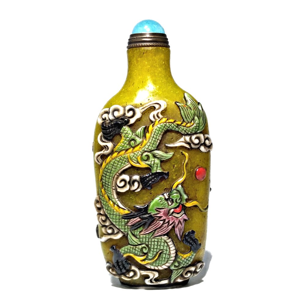 PEKING GLASS ENAMEL SNUFF BOTTLE DRAGONS: THE CARVED AND ENAMELED GLASS SNUFF BOTTLE FEATURES FIERCE AND PROUD DRAGONS ON BOTH SIDES. THE BOTTLE IS 3.5 INCHES TALL. PROVENANCE: PRIVATE FLORIDA COLLECTION.