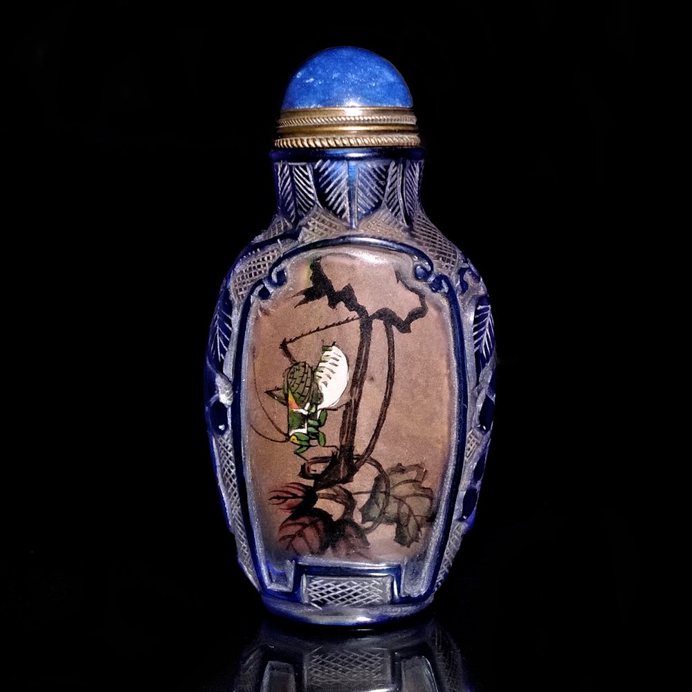 CHINESE CARVED PAINTED INSIDE SNUFF BOTTLE CRICKET: THE BEAUTIFULLY CARVED BOTTLE IS ALSO PAINTED INSIDE WITH TWO CRICKET SCENES. THE BOTTLE IS INSCRIBED AND SIGNED. 3 INCHES TALL.