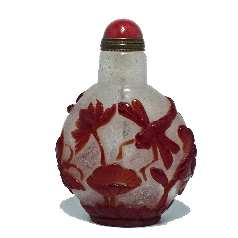 CHINESE PEKING GLASS SNUFF BOTTLE BUTTERFLY LOTUS DRAGONFLY: THE CARVED PEKING GLASS SNUFF BOTTLE DEPICTS BUTTERFLIES, A DRAGONFLY, LOTUS AND WAVES. THE BOTTLE IS 2.7 INCHES TALL. STANDS ARE FOR DISPLAY ONLY, NOT INCLUDED UNLESS OTHERWISE STATED. PROPERTY OF A