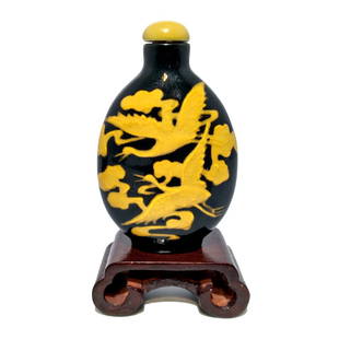 A RARE ANTIQUE CHINESE SNUFF BOTTLE ENAMEL ON GLASS STORKS 18-19TH CENTURY: THE RARE BOTTLE FEATURES A MOLDED BLACK GLASS BODY AND BAKED ON GLASS ENAMELING FEATURING STORKS IN FLIGHT. IT IS A SMALL TREASURE IN AN UNUSUAL COLOR COMBINATION. ESTIMATED AGE IS 18-19TH CENTURY. IT