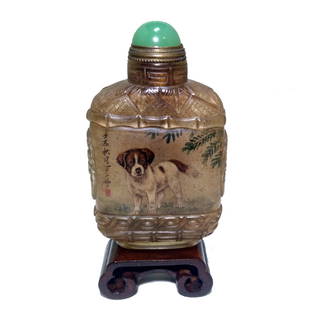 A FINE CHINESE SIGNED INSIDE PAINTED SNUFF BOTTLE DOGS: THE FINE BOTTLE IS WELL CARVED AND POLISHED. IT IS PAINTED ON THE INSIDE WITH IMAGES OF DOGS AND DELICATE SURROUNDING DETAIL. THE BOTTLE IS ARTIST SIGNED. THE BOTTLE IS 3 INCHES TALL. STANDS ARE FOR D
