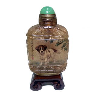 A FINE CHINESE SIGNED INSIDE PAINTED SNUFF BOTTLE DOGS: THE FINE BOTTLE IS WELL CARVED AND POLISHED. IT IS PAINTED ON THE INSIDE WITH IMAGES OF DOGS AND DELICATE SURROUNDING DETAIL. THE BOTTLE IS ARTIST SIGNED. THE BOTTLE IS 3 INCHES TALL. STANDS ARE FOR