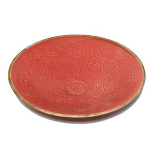 FINE CHINESE PORCELAIN INCISED BOWL CORAL GLAZE CHILDREN: THE REFINED CHINESE BOWL WITH AN INCISED CHILDREN AND FLORAL PATTERN, LOTUS AND A STYLIZED CLOUD BORDER. IT IS 8 INCHES WIDE.THE GLAZE IS OF PEACH COLOR. SOME FIRING IMPERFECTIONS ON OUTER SIDE. STAND