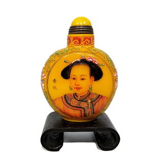 FINE CHINESE IMPERIAL PORTRAIT ENAMEL SNUFF BOTTLE QIANLONG MARK: THE SUPERBLY ENAMELED BOTTLE ON YELLOW PEKING GLASS, INSCRIBED AND PAINTED WITH MUCH EXQUISITE DETAIL. THE BOTTLE IS 2.75 INCHES TALL. STANDS ARE FOR DISPLAY ONLY, NOT INCLUDED UNLESS OTHERWISE STATED
