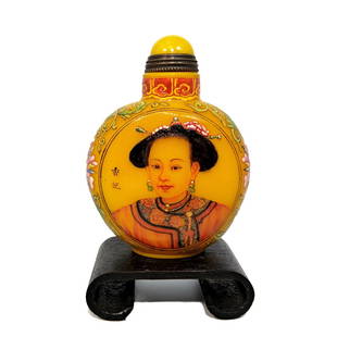 FINE CHINESE IMPERIAL PORTRAIT ENAMEL SNUFF BOTTLE QIANLONG MARK: THE SUPERBLY ENAMELED BOTTLE ON YELLOW PEKING GLASS, INSCRIBED AND PAINTED WITH MUCH EXQUISITE DETAIL. THE BOTTLE IS 2.75 INCHES TALL. STANDS ARE FOR DISPLAY ONLY, NOT INCLUDED UNLESS OTHERWISE