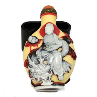 A SUPERB CHINESE GLASS SNUFF BOTTLE GUANYIN ON DRAGON: THIS IS A FABULOUS, VERY WELL CARVED CHINESE SNUFF BOTTLE CARVED IN FOUR LAYERS OF GLASS. IT DEPICTS GUANYIN ON A DRAGON AND GUANYIN IN A MEDITATIVE POSE. IT BEARS A QIANLONG SEAL. PROVENANCE: A PRIVA