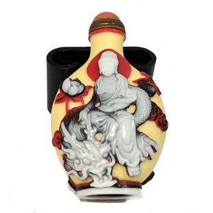 A SUPERB CHINESE GLASS SNUFF BOTTLE GUANYIN ON DRAGON: THIS IS A FABULOUS, VERY WELL CARVED CHINESE SNUFF BOTTLE CARVED IN FOUR LAYERS OF GLASS. IT DEPICTS GUANYIN ON A DRAGON AND GUANYIN IN A MEDITATIVE POSE. IT BEARS A QIANLONG SEAL. PROVENANCE: A