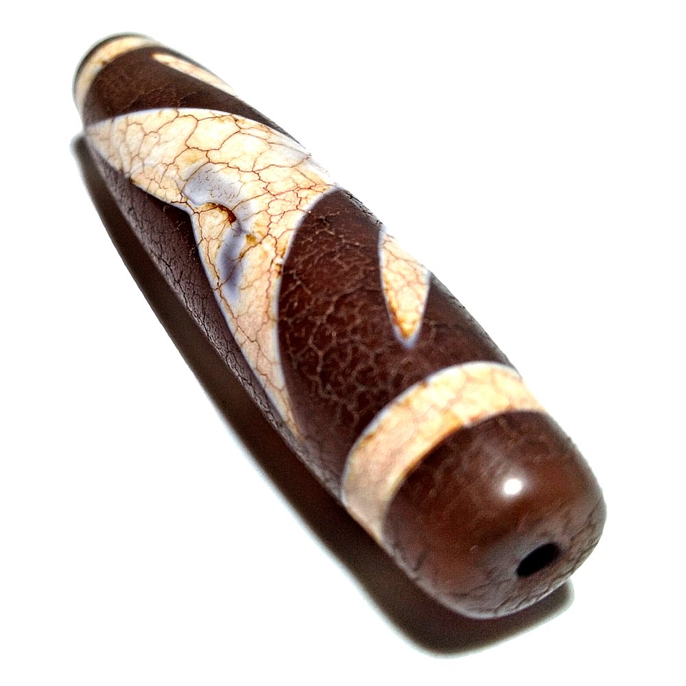 SUPERB SINO-TIBETAN AGATE DZI BEAD 58MM: THE RARE CARNELIAN AGATE DZI BEAD MEASURES 48MM. IT DISPLAY EXCELLENT PATINA AND WEAR.