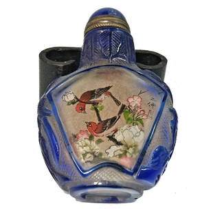 A FINE INSIDE PAINTED OVERLAY GLASS SNUFF BOTTLE BIRDS: THE OUTSTANDING BOTTLE IS BEAUTIFULLY HAND PAINTED ON THE INSIDE, AND DECORATED WITH FINELY CARVED OVERLAY. IT IS INSCRIBED WITH A SIGNED POEM. IT IS 2.75 INCHES TALL. PROVENANCE: FLORIDA PRIVATE