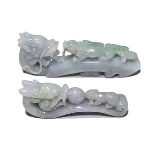 GROUP OF TWO CHINESE EXQUISITE JADEITE BELT BUCKLES: THE TWO EXCELLENT BELT BUCKLES ARE WELL CARVED WITH SMOOTH LINES OUT OF NATURAL, UNDYED JADEITE. THE FEATURE DRAGONS. ONE BUCKLE IS 3.5 INCHES LONG AND THE OTHER IS 2.6 INCHES LONG. THE COLOR IS A LIG