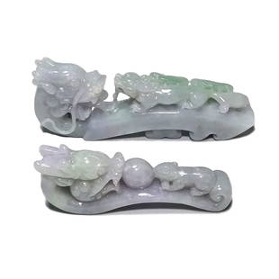 GROUP OF TWO CHINESE EXQUISITE JADEITE BELT BUCKLES: THE TWO EXCELLENT BELT BUCKLES ARE WELL CARVED WITH SMOOTH LINES OUT OF NATURAL, UNDYED JADEITE. THE FEATURE DRAGONS. ONE BUCKLE IS 3.5 INCHES LONG AND THE OTHER IS 2.6 INCHES LONG. THE COLOR IS A