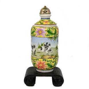 A SUPERB CHINESE FAMILLE ROSE ROTATING PORCELAIN SNUFF BOTTLE QIANLONG: A RARE CHINESE YELLOW GROUND FAMILLE ROSE ROTATING SNUFF BOTTLE, PUPPY PATTERN. THE FINE GILDED SNUFF BOTTLE WITH A RARE DOG PATTERN AND QIANLONG MARK. THE BOTTLE IS 3.25 INCHES TALL. STANDS ARE FOR D