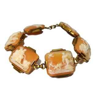 A VERY WELL CARVED SHELL CAMEO BRACELET MYTHOLOGY 7": THE STUNNING BRACELET FEATURES 6 PANELS OF VERY WELL CARVED SHELL CAMEOS DEPICTING GREEK GODS.EACH PANEL IS 3/4" LONG. THE BRACELET IS 3/4" WIDE.IT IS SET IN GILDED METAL. WE PROVIDE IN-HOUSE