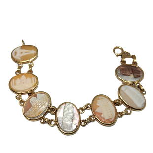 A VERY WELL CARVED SHELL CAMEO BRACELET GRAND TOUR 8": THE RARE BRACELET FEATURES 7 PANELS OF VERY WELL CARVED SHELL CAMEOS DEPICTING A CUSTOM MADE GRAND TOUR, MADE FOR A PERSON TO FEATURE THE PLACES VISITED. IT INCLUDES THE SPHYNXS AND PYRAMIDS, THE