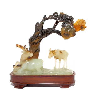 A MASTERFUL ANTIQUE CHINESE JADE STATUE DEER AND TREE 18-19TH C: MASTERFUL ANTIQUE CHINESE JADE CARVING STATUE DEER AND TREE HUANGHUALI STAND 18th-19th C. The exquisitely carved rare Chinese work of art displayed on its own fitted huanghuali stand. The refined carv