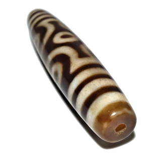 A FINE SINO-TIBETAN MASTER AGATE DZI BEAD 6 EYES 66MM: THE EXCELLENT MASTER AGATE DZI BEAD FEATURES 6 EYES. IT IS 66MM LONG AND FEATURES PATINA FROM AGE. PROVENANCE: PRIVATE FLORIDA COLLECTOR. WE PROVIDE IN-HOUSE SHIPPING FOR A SMOOTH TRANSACTION.