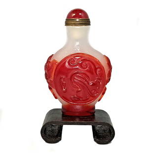 BEAUTIFUL CHINESE SNUFF BOTTLE RED PEKING GLASS DRAGON: THIS IS A BEAUTIFULLY CHINESE CARVED SNUFF BOTTLE, IN TWO LAYERS OF GLASS. THE BOTTLE DEPICTS CHILUNG. IT IS 3 INCHES LONG. PROVENANCE: PRIVATE FLORIDA COLLECTOR. WE PROVIDE IN-HOUSE SHIPPING FOR