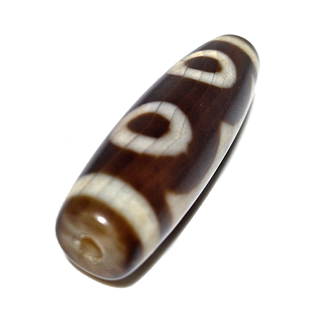 A FINE SINO-TIBETAN AGATE DZI BEAD 3 EYES 42MM: THE EXCELLENT SINO-TIBETAN AGATE DZI BEAD FEATURES 3 EYES. IT IS 42MM LONG AND FEATURES PATINA FROM AGE. PROVENANCE: PRIVATE FLORIDA COLLECTOR. WE PROVIDE IN-HOUSE SHIPPING FOR A SMOOTH TRANSACTION.