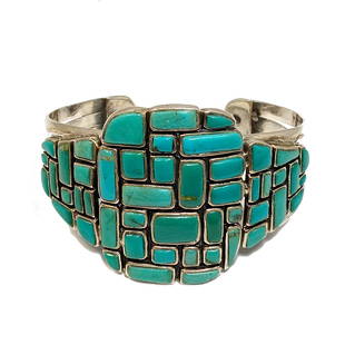 A STUNNING LARGE SOUTWESTERN TURQUOISE INLAY CUFF STERLING: THE STUNNING CUFF IS INLAID WITH TURQUOISE, SET IN STERLING SILVER, MARKED 925. THE BRACELET IS 1.75 WIDE AT WIDEST POINT. IT IS 2.5 IN INNER DIAMETER. WE PROVIDE IN-HOUSE SHIPPING.