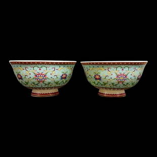 A FINE PAIR OF CHINESE BOWLS FAMILLE ROSE TURQUOISE LOTUS: THE PAIR OF BOWLS IS ENAMELED WITH TURQUOISE GROUND AND LOTUS MOTIFS IN PASTEL COLORS. THE BOWLS ARE 5 INCHES WIDE AND 3 INCHES TALL. IN VERY GOOD CONDITION. QIANLONG MARK. WE PROVIDE IN-HOUSE