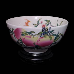 A STUNNING CHINESE BOWL FAMILLE ROSE: THE BOWLS IS ENAMELED WITH PEACH AND BAT MOTIFS IN PASTEL COLORS. IT IS 6 INCHES WIDE AND 4 INCHES TALL. IN VERY GOOD CONDITION. QIANLONG MARK ON UNDERSIDE. WE PROVIDE IN-HOUSE SHIPPING FOR YOUR