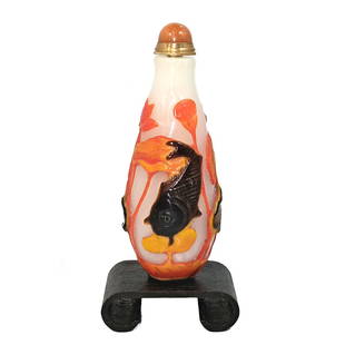 SUPERB CHINESE PEKING GLASS SNUFF BOTTLE KOI LOTUS: THIS IS A WELL CARVED CHINESE SNUFF BOTTLE CARVED IN FOUR LAYERS OF GLASS. IT DEPICTS KOI FISH AND LOTUS ON A MILK GLASS BACKGROUND. THE BOTTLE IS 3.5 INCHES TALL. PROVENANCE: A PRIVATE COLLECTION, FL