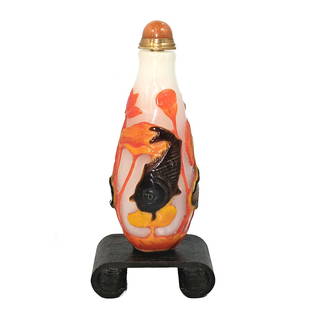 SUPERB CHINESE PEKING GLASS SNUFF BOTTLE KOI LOTUS: THIS IS A WELL CARVED CHINESE SNUFF BOTTLE CARVED IN FOUR LAYERS OF GLASS. IT DEPICTS KOI FISH AND LOTUS ON A MILK GLASS BACKGROUND. THE BOTTLE IS 3.5 INCHES TALL. PROVENANCE: A PRIVATE COLLECTION,