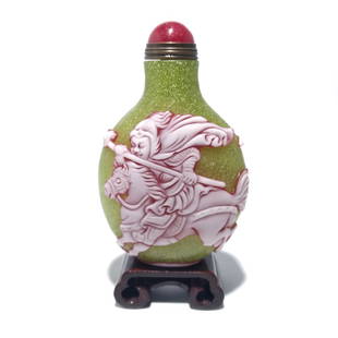 CHINESE PEKING GLASS SNUFF BOTTLE GENERAL ON HORSE: THE EXCELLENT CHINESE SNUFF BOTTLE IS CARVED IN RED AND WHITE LAYERS OVER A LIME GREENISH/YELLOW GLASS. THERE IS SO MUCH MOVEMENT IN THE IMAGE OF THE GENERAL RIDING HIS HORSE AND CHARGING IN BATTLE.