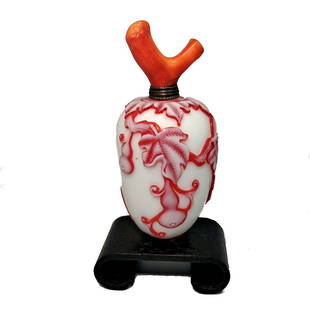 A WELL CARVED CHINESE SNUFF BOTTLE GOURD BAT QIANLONG SEAL: THE CHINESE SNUFF BOTTLE IS SO WELL CARVED IN THREE LAYERS OF COLOR. THE DETAIL IS EXQUISITE. THE BOTTLE FEATURES A GOURD AND A BAT. IT IS 3 INCHES LONG. IT BEARS A QIANLONG SEAL. PROVENANCE: PRIVATE