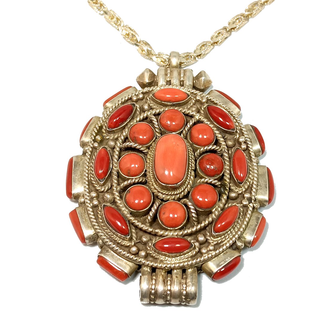 FANTASTIC SOUTHWESTERN NECKLACE OF CORAL AND STERLING SILVER: THE FANTASTIC SOUTHWESTERN NECKLACE WEIGHS 94 GRAMS AND MARKED 925. THE CORAL STUDDED PENDANT IS 3" BY 2.4" IN SIZE. THE PENDANT ALSO OPENS, AS A BOX OR LOCKET. THE STERLING SILVER NECKLACE IS 24" LON